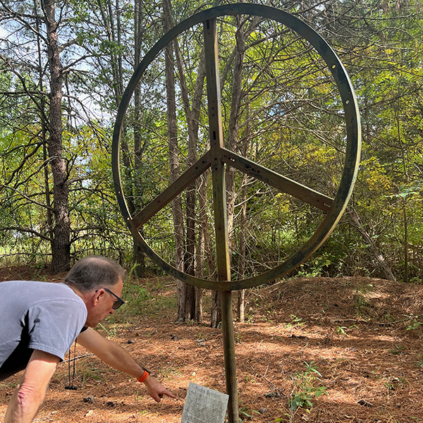 Image of peace sign sculpture.