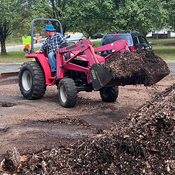 Image of Dr. Jack driving a tractor.