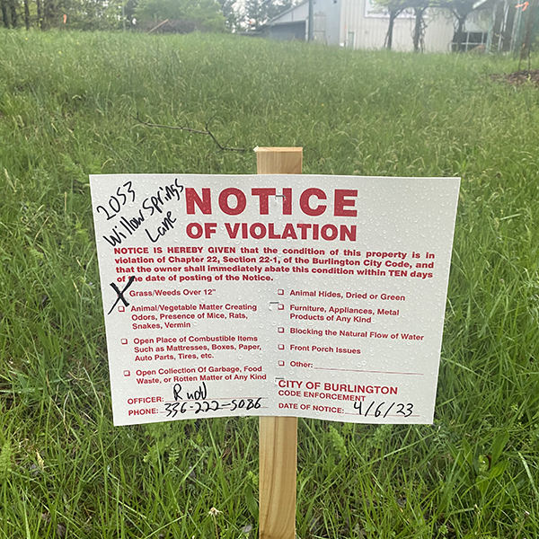 Image of notice from the city that our grass is too high.