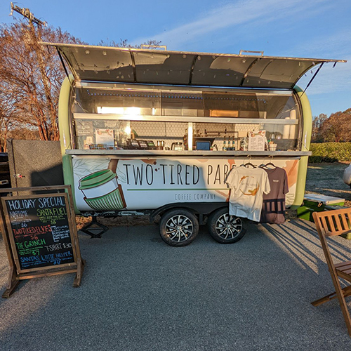Image of the coffee truck with TS Designs t-shirts hanging out front.