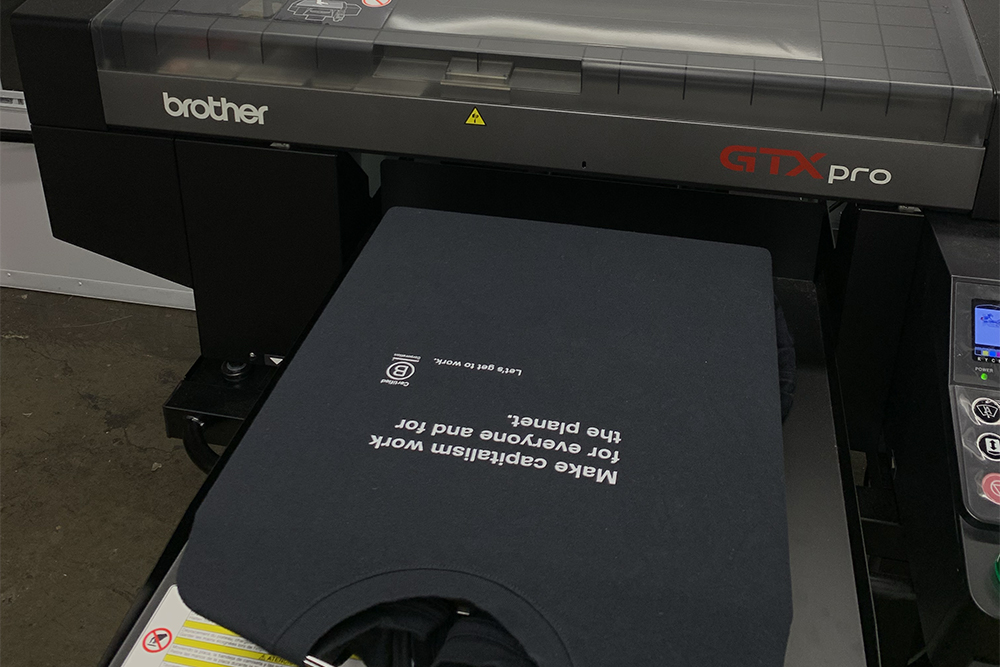 Image of a bcorpwear shirt being printed on a DTG printer