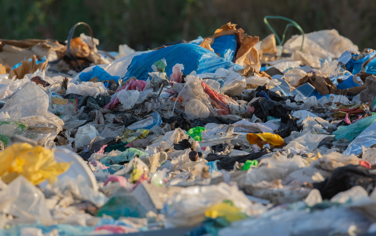 A pile of plastic packaging waste in a landfill