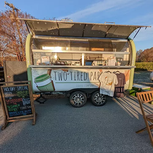 original-038B80A0-4513-411C-966D-EFC923E70376 Image of the coffee truck with TS Designs t-shirts hanging out front.