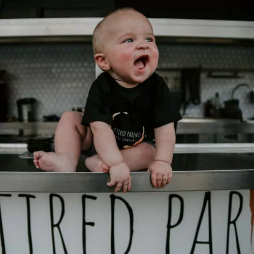 original-8CA74088-971B-4C2E-A5E3-414C898BD366 Adorable 18 month baby of the two tired parents, sitting on the food truck.